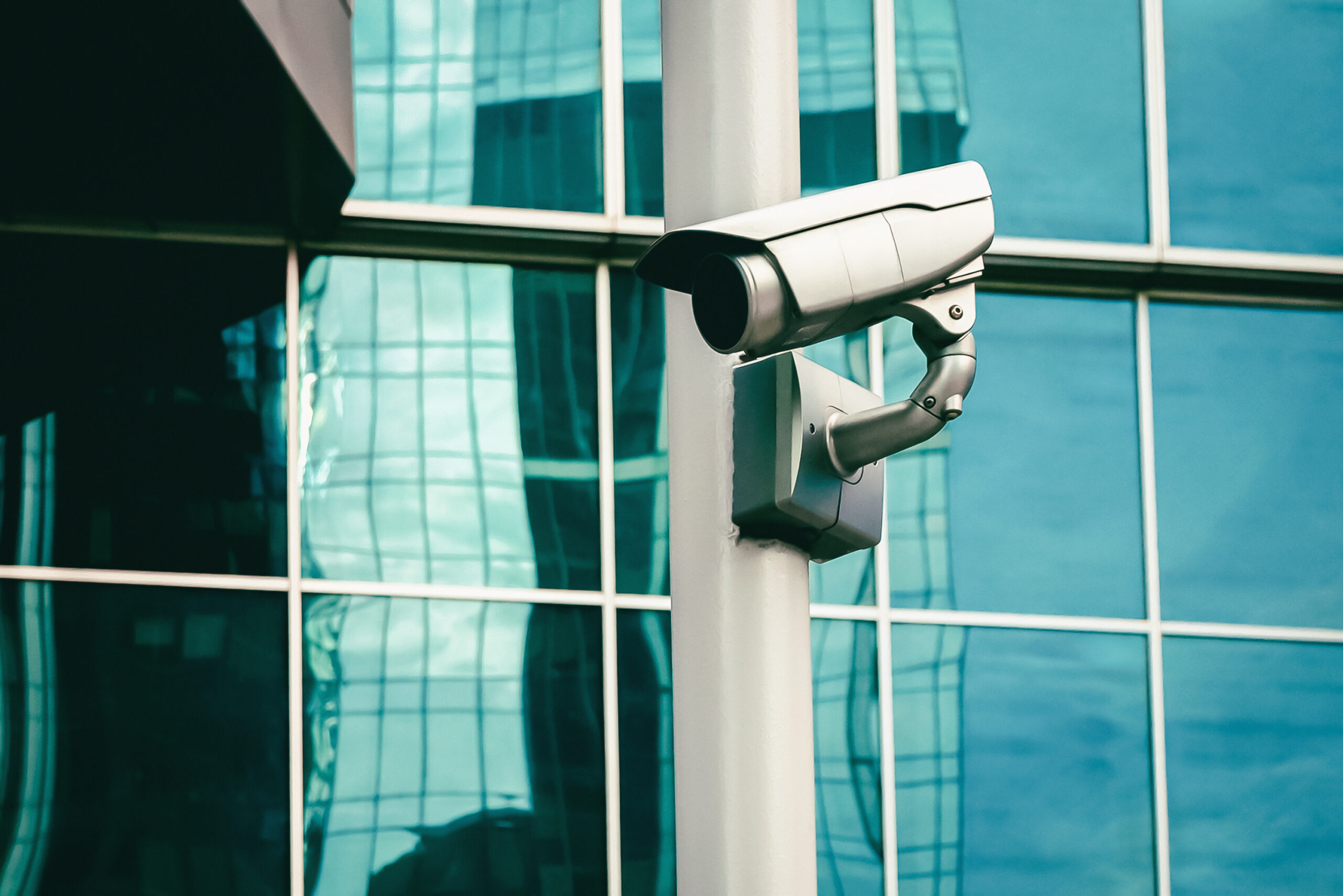 An outdoor security camera guarding a business